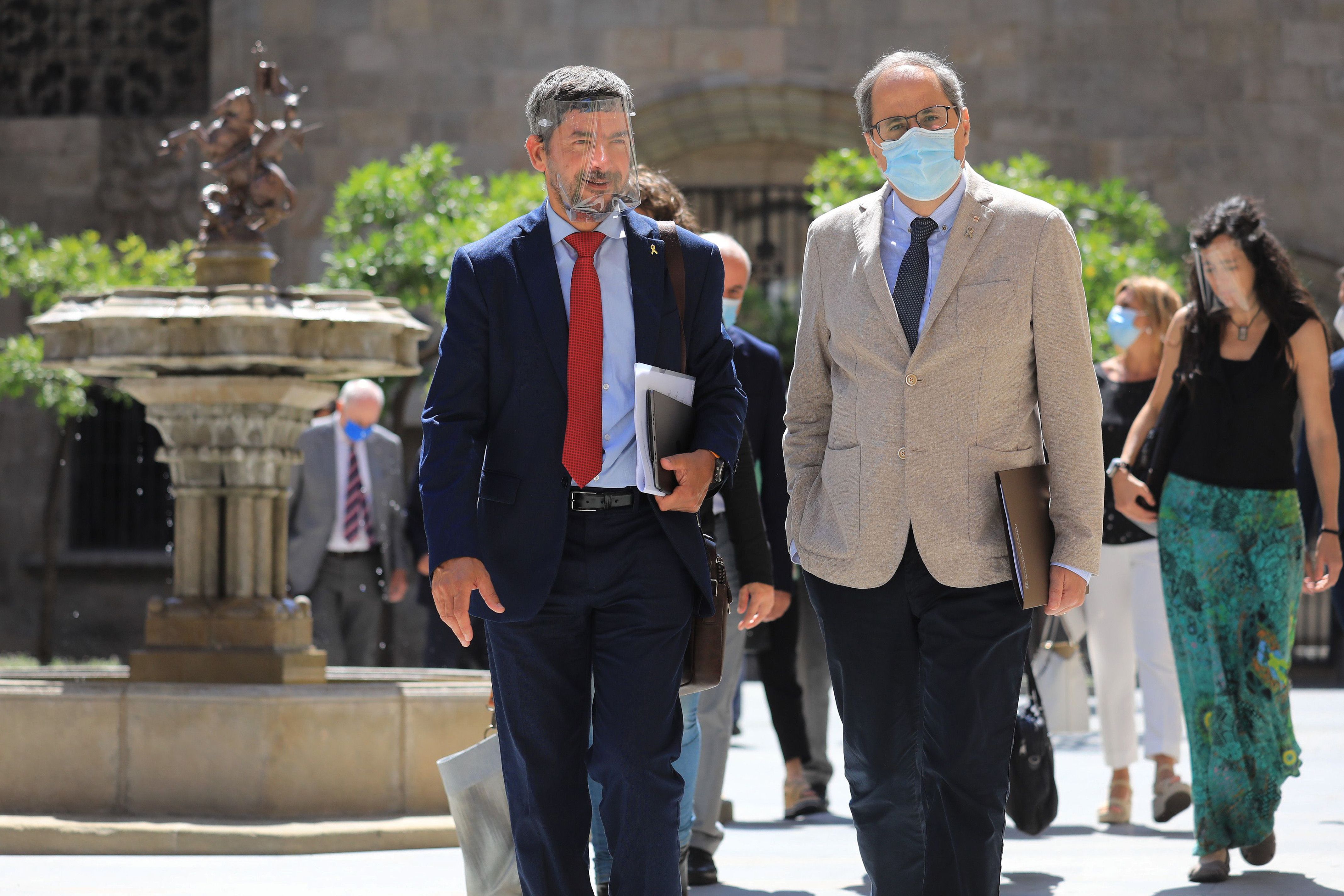 Joan Canadell, president del Consell General de Cambres de Comerç de Catalunya, i Quim Torra, president de la Generalitat, es dirigeixen a la reunió de la CORECO | ACN